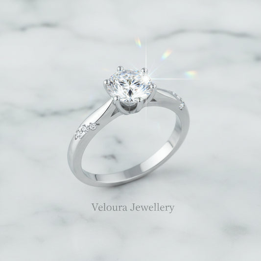 Silver ring with a large diamond on a white background